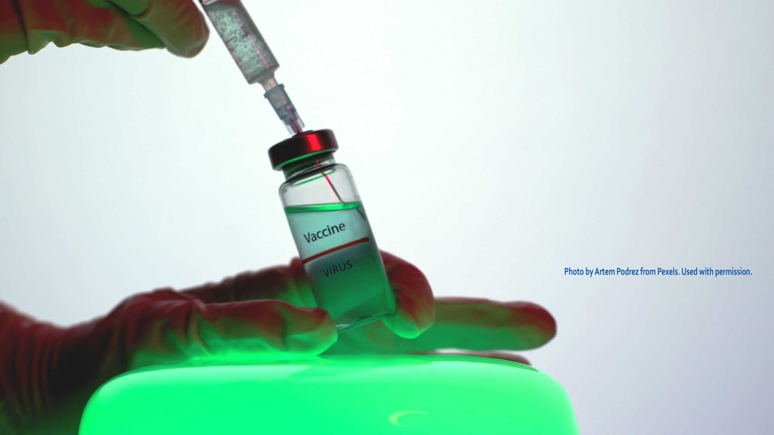 Syringe inserted in vaccine vial. Photo by Artem Podrez from Pexels. Used with permission.