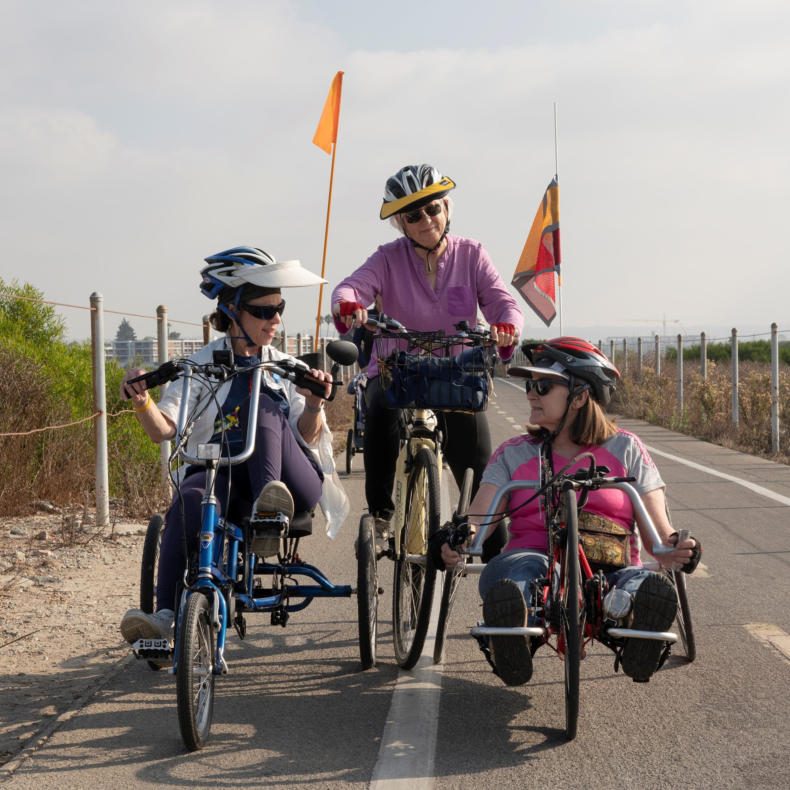 Bike Group_sq A group of three enjoying an adaptive cycling outing.