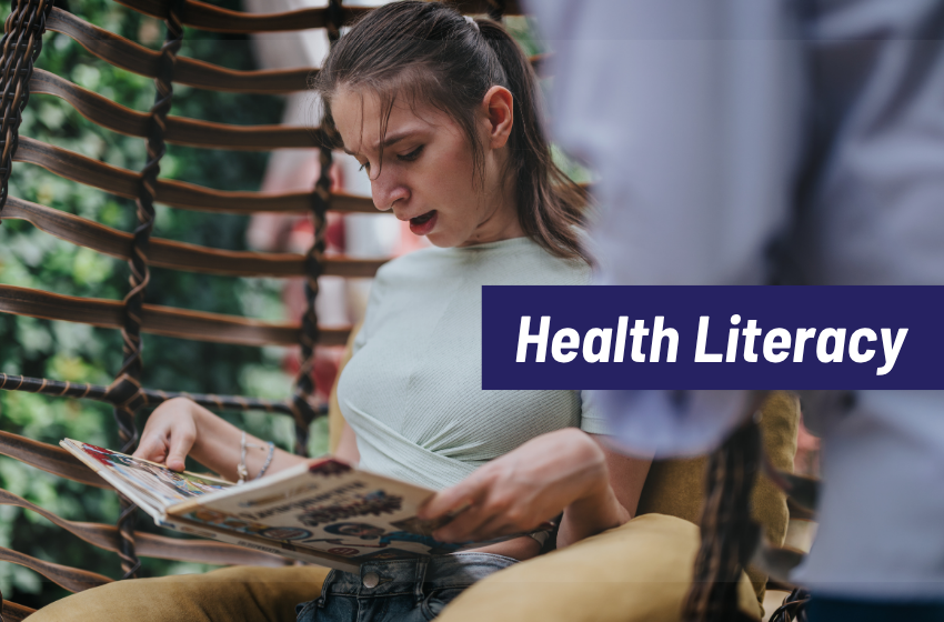A young disabled woman reading a book outside on a wicker chair. Health Literacy.